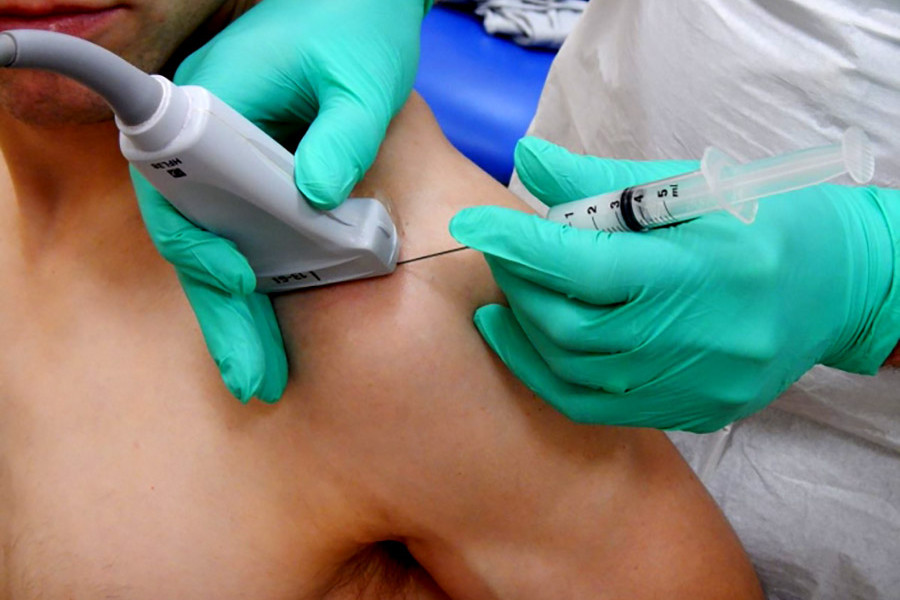 a patient is having an ultrasound guided injection in the sonoscope pain clinic